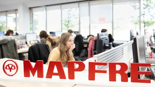 MAPFRE people working at office