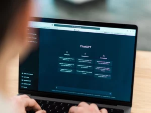Generative Engine Optimization Agency for Global Visibility in AI-Driven Search User types on a laptop keyboard, viewing the introductory screen of the ChatGPT interface on the screen.